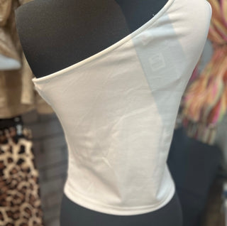 White one shoulder tank top with large floral accent on the shoulder with a fitted silhouette