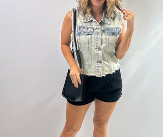 Womens sleeveless denim vest with raw hem and sparkling rhinestone embellishments, Perfect piece for concerts and downtown Nash.