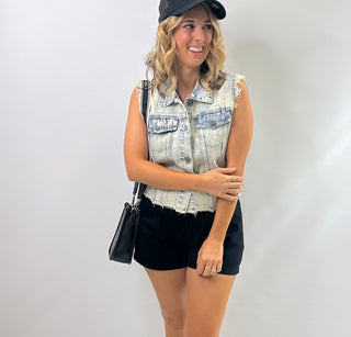 Womens sleeveless denim vest with raw hem and sparkling rhinestone embellishments, Perfect piece for concerts and downtown Nash.