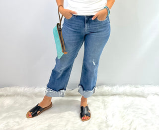 Mid-Rise slim wide-leg jean with a raw cuffed hem, light medium denim wash, relaxed structured fit by Flying Monkey