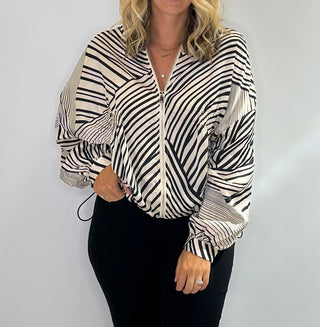 Zip Front bomber style jacket with black and white stripes, front pockets, and adjustable drawstring waist in lightweight polyester fabric