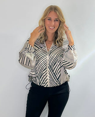 Zip Front bomber style jacket with black and white stripes, front pockets, and adjustable drawstring waist in lightweight polyester fabric