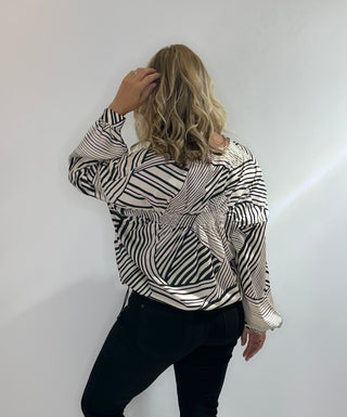 Zip Front bomber style jacket with black and white stripes, front pockets, and adjustable drawstring waist in lightweight polyester fabric