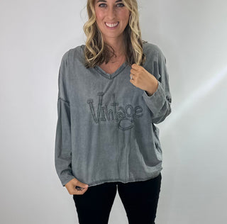 Womens Long Sleeve 100% Cotton v neck shirt with raised word "vintage" lettering on front