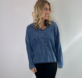 Womens Long Sleeve 100% Cotton v neck shirt with raised word "vintage" lettering on front
