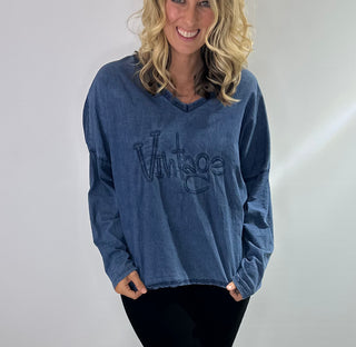 Womens Long Sleeve 100% Cotton v neck shirt with raised word "vintage" lettering on front