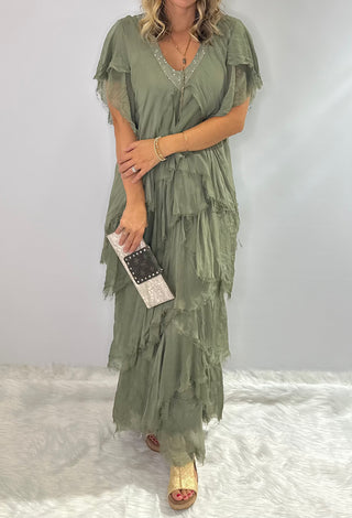 Long, tiered sage green silk maxi dress with v neckline, ruffled accents and sequin embellishments