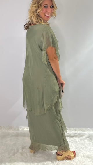Long, tiered sage green silk maxi dress with v neckline, ruffled accents and sequin embellishments