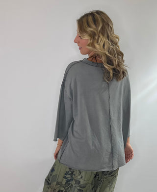 Oversized slate gray cotton top with exposed stitching and 3/4 length sleeve tee