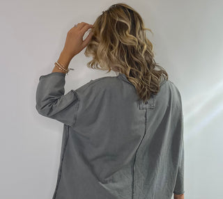 Oversized slate gray cotton top with exposed stitching and 3/4 length sleeve tee