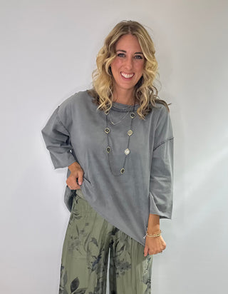 Oversized slate gray cotton top with exposed stitching and 3/4 length sleeve tee
