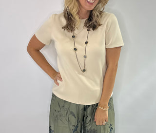 Soft crewneck color block tee in black, taupe, and cream with relaxed fit and short sleeves.