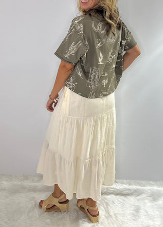 Women's Rust and Sage western graphic cropped tee with cowboy boots, hats, horseshoe and cactus print