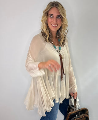 Cream Sheer silk blouse with ruffle details and lightweight fabric