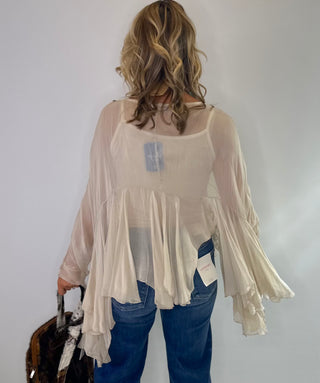 Cream Sheer silk blouse with ruffle details and lightweight fabric