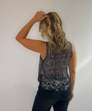 Cropped black and silver sheer tank top with sequins, diamond pattern, high neck, button back closure and side slits