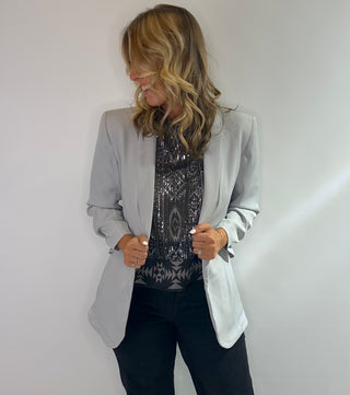 Cropped black and silver sheer tank top with sequins, diamond pattern, high neck, button back closure and side slits