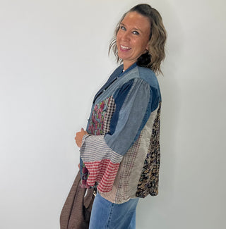 Pintucked denim button-front shirt with mixed patchwork bell sleeves and collared neckline
