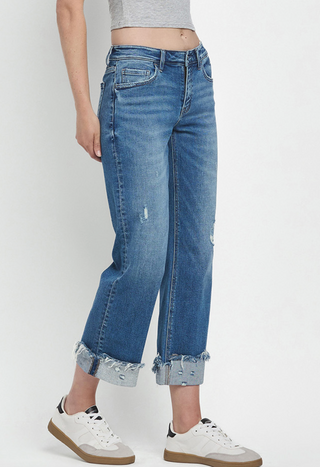 Mid-Rise slim wide-leg jean with a raw cuffed hem, light medium denim wash, relaxed structured fit by Flying Monkey