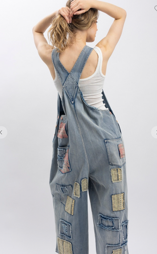 Blue Velvet Wildflower Roads Overalls in vintage-washed denim with boho embroidery, patchwork details, and oversized relaxed fit