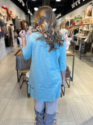 Vintage Sparrow graphic tee in turquoise with distressed tattered finish and subtle sparkle detail on 100% cotton