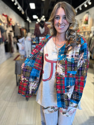 Oversized reversible patchwork flannel top with quilt inspired panels and royal zigzag stitching in multicolor fabric