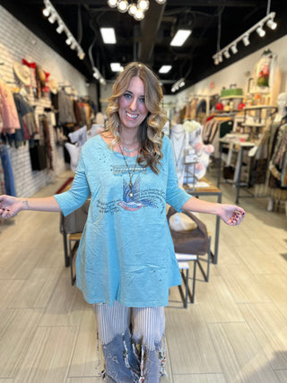 Vintage Sparrow graphic tee in turquoise with distressed tattered finish and subtle sparkle detail on 100% cotton