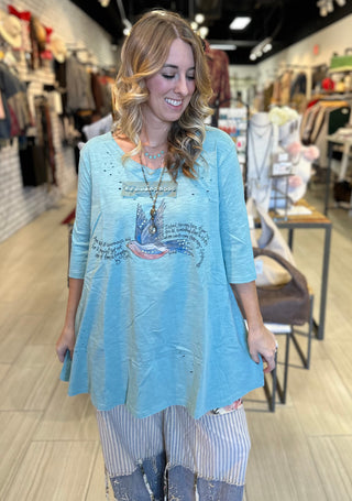 Vintage Sparrow graphic tee in turquoise with distressed tattered finish and subtle sparkle detail on 100% cotton