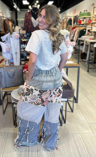Vintage inspired patchwork chambray wide leg pants with tiered panels, rose prints, stripes and crochet detailing a quilted boho design. 