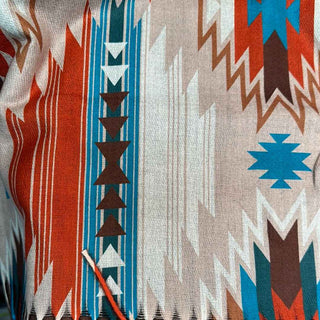 Aztec Western stripe poncho top with side and shoulder button details in cream, beige, turquoise and rust