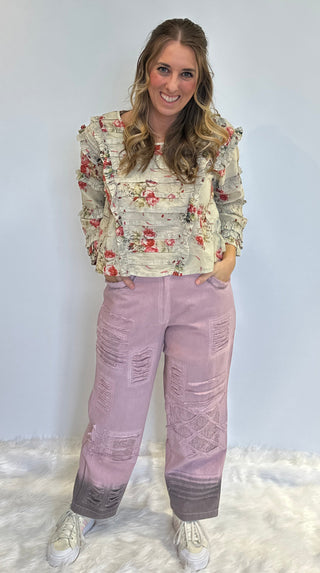 Lilac boho denim pants in 100% cotton with lace accents, brown ombre spray detail, elastic back waistband, and relaxed statement silhouette.