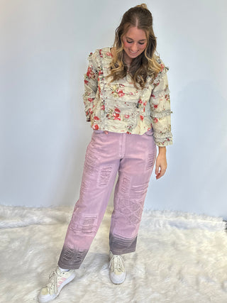 Lilac boho denim pants in 100% cotton with lace accents, brown ombre spray detail, elastic back waistband, and relaxed statement silhouette.
