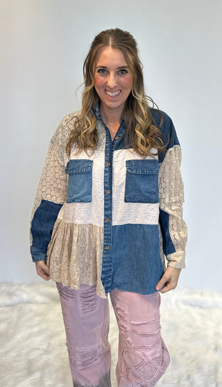 Mixed media denim shirt with lace patchwork, button-up front, long sleeves, and relaxed boho shirt-jacket fit.