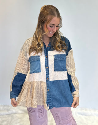 Mixed media denim shirt with lace patchwork, button-up front, long sleeves, and relaxed boho shirt-jacket fit.