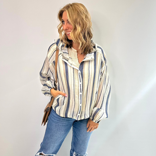 The Seaside Breeze lightweight button front jacket features light blues grays and beige stripes, hooded, pockets and drawstring waist. Wear as a lightweight Jacket or an open front button up 