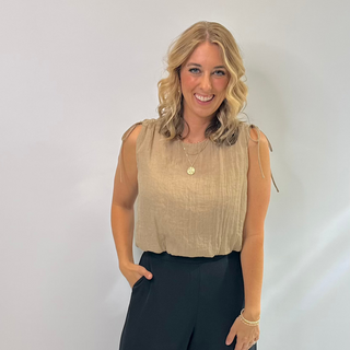 Lightweight Gauze feel, comfortable cap sleeve crop top style with ties on the shoulder perfect Top for transitional seasons and summer in a tan. 