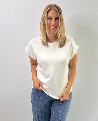 Women's cap sleeve top made from smooth, lightweight fabric with a relaxed, structured fit in Ivory
