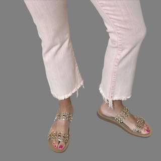 Double Take Sandals by Corky feature a soft sole and clear straps with gold embellished rhinestones. 