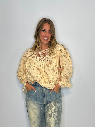 Jaded Gypsy Forever Bloom | Artisanal Floral Crochet Blouse in Premium Cotton Floral blouse with lace neckline on a wooden surface