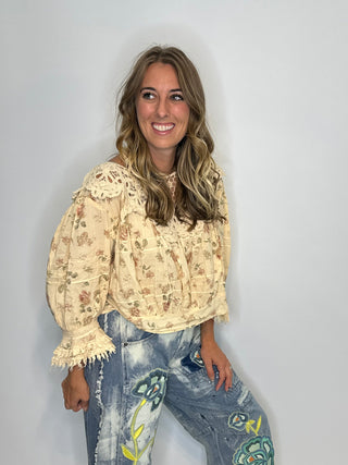 Jaded Gypsy Forever Bloom | Artisanal Floral Crochet Blouse in Premium Cotton Floral blouse with lace neckline on a wooden surface