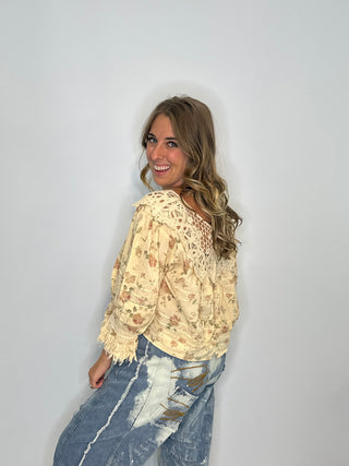 Jaded Gypsy Forever Bloom | Artisanal Floral Crochet Blouse in Premium Cotton Floral blouse with lace neckline on a wooden surface