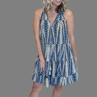 Sleeveless Tiered Flowy Sundress Featuring a flattering tiered design and a lightweight, flowing fabric, this dress is perfect for your next tropical vacation or beach resort getaway.geometric pattern in navy blue and gold