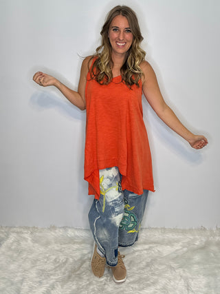 Asymmetrical sleeveless tunic in vintage tangerine, made of soft preshrunk cotton with a flowing, handcrafted look.