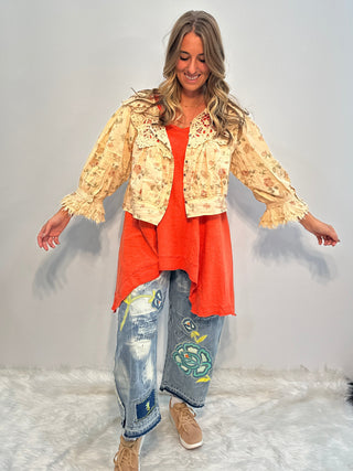 Asymmetrical sleeveless tunic in vintage tangerine, made of soft preshrunk cotton with a flowing, handcrafted look.