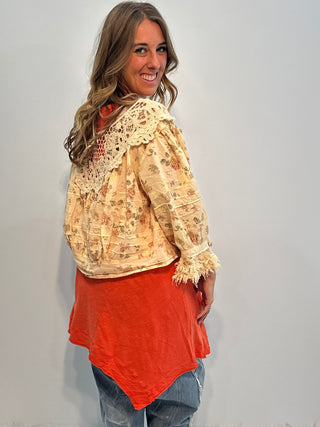 Asymmetrical sleeveless tunic in vintage tangerine, made of soft preshrunk cotton with a flowing, handcrafted look.