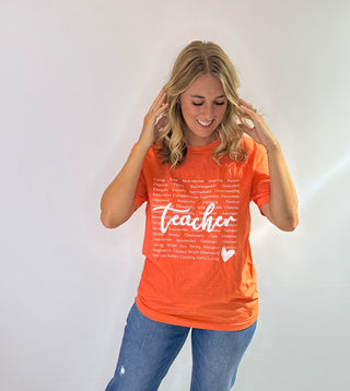Graphic t-shirt with heart design made of positive teacher words in green and orange with white text. Teachers