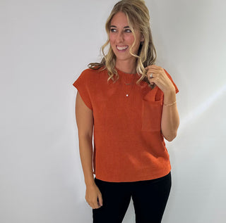 Women's round neck short sleeve knit sweater with a front chest pocket relaxed fit