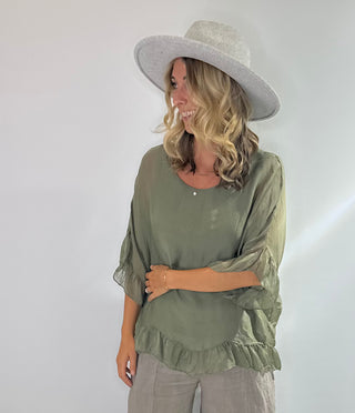 Sage Green oversized silk blouse with ruffle short sleeves, ruffle hem, and back keyhole button closure