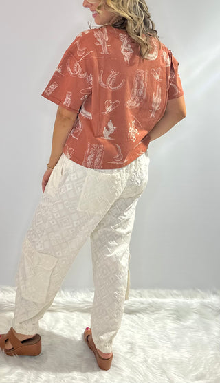 Cream jogger pants with embroidered diamond pattern, elastic drawstring waist and front and back pockets by Jaded Gypsy