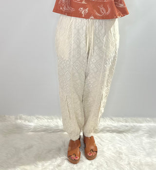 Cream jogger pants with embroidered diamond pattern, elastic drawstring waist and front and back pockets by Jaded Gypsy